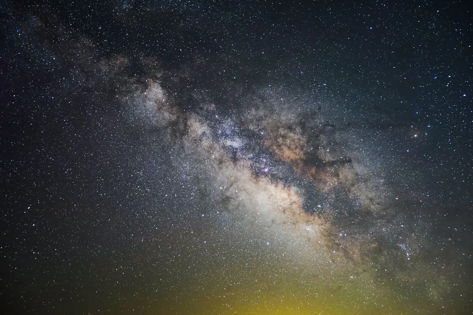 The bright band of the Milky Way crossing a night sky full of stars
