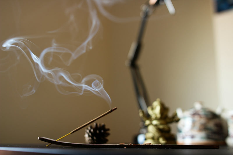 Incense smoke rising during a traditional ritual offering