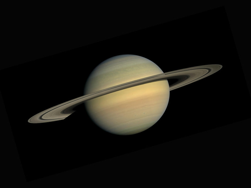 The planet Saturn with its rings against deep space